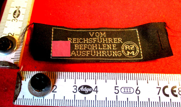 SS Stoff-Etikett „Reichsführer SS“ – RZM-gemarkt, ca. 8×3 cm, Original | Art.-Nr. 34523